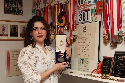 Celestina Popa Toma with her olympic medal